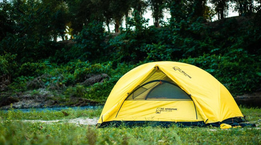 Yellow tent in a campsite 